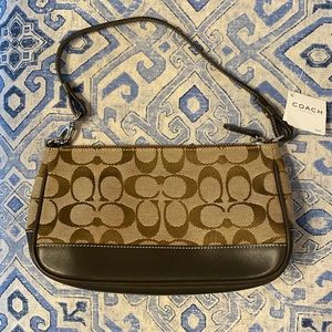 Brand new Coach handbag. Brown canvas with leather trim. Still has tag.